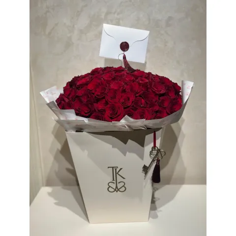 Hundred Hearts red rose bouquet in elegant presentation box with key accent from The Key Boutique