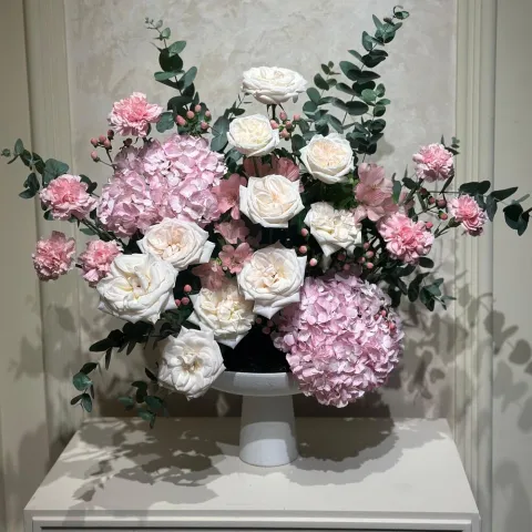 "Serenade Pink Serenade centerpiece on table at anniversary celebration"