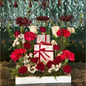 Luxurious burgundy flower bouquet with red roses, white roses, and vibrant carnations, ideal for gifting on special occasions.
