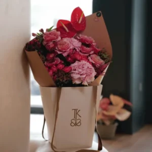 Fuchsia Flame Bouquet featuring vibrant pink fuchsia blooms and lush greenery