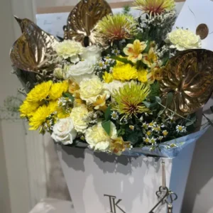 Gilded Grace bouquet with white roses and golden anthuriums