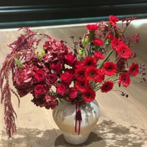 Midnight Bloom Floral Arrangement – Gerberas, Roses, Hydrangeas, and Amaranthus