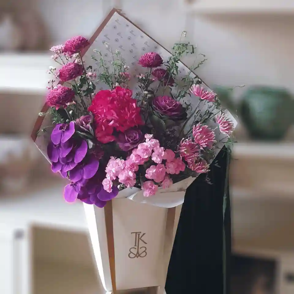 Cheerful Blossoms Bouquet featuring vibrant roses, tulips, and peonies