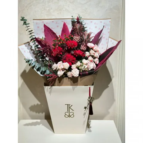 Rosy Splendor bouquet with vibrant roses and lush greenery